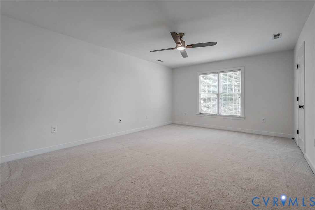 2306 Founders Bridge Road Midlothian, VA 23113 - Photo 37 of 50 an empty room with a window and ceiling fan