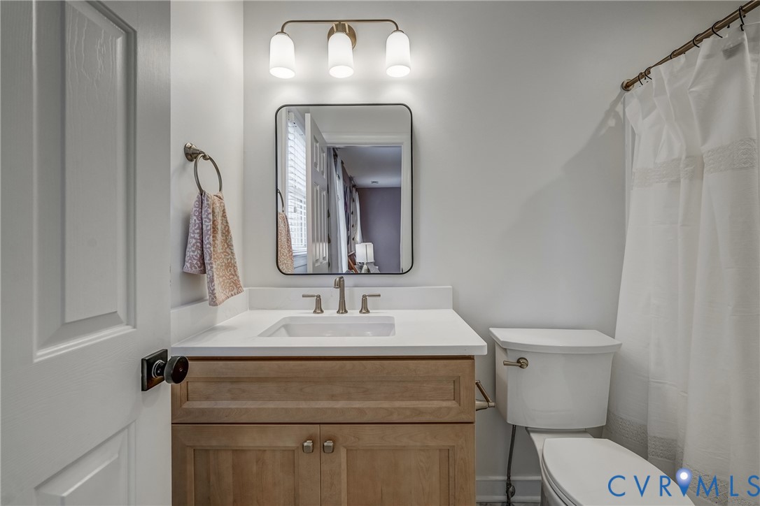 2306 Founders Bridge Road Midlothian, VA 23113 - Photo 38 of 50 a bathroom with a toilet sink and mirror