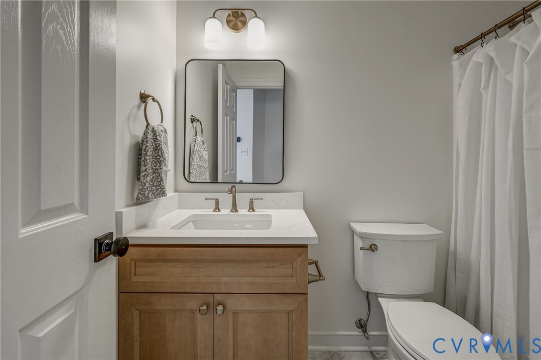 2306 Founders Bridge Road Midlothian, VA 23113 - Photo 41 of 50 a bathroom with a toilet sink and mirror