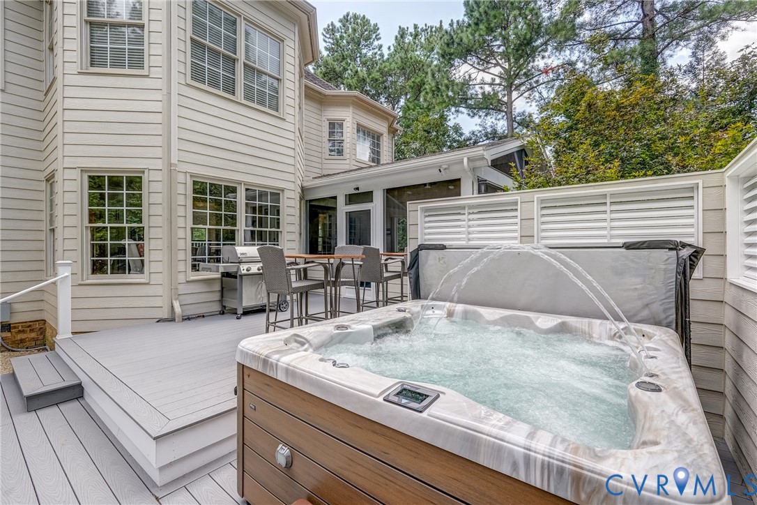2306 Founders Bridge Road Midlothian, VA 23113 - Photo 45 of 50 a view of a patio with table and chairs with wooden floor and fence