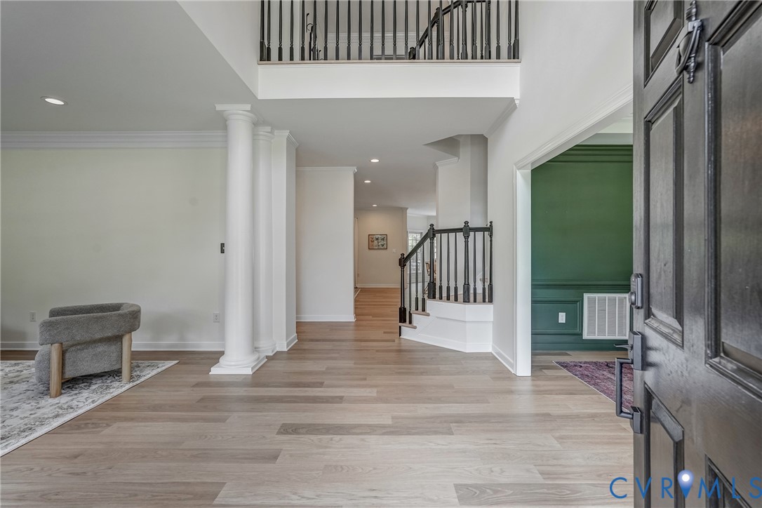 2306 Founders Bridge Road Midlothian, VA 23113 - Photo 5 of 50 a view of a hallway with wooden floor and staircase