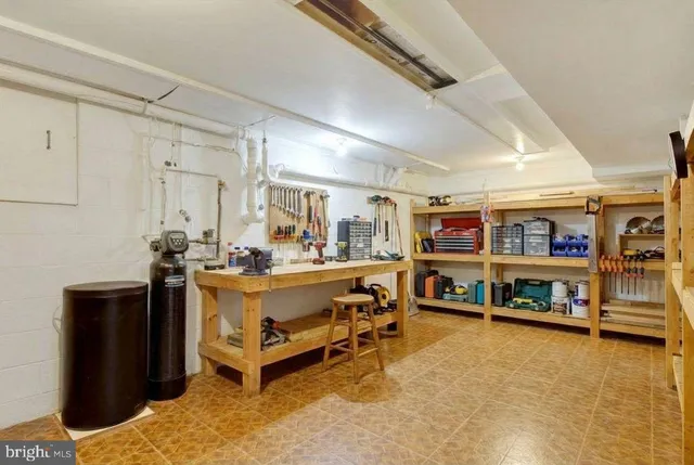a living room with lots of furniture and white walls