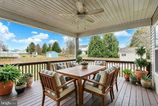 a view of a house with a yard porch and sitting area