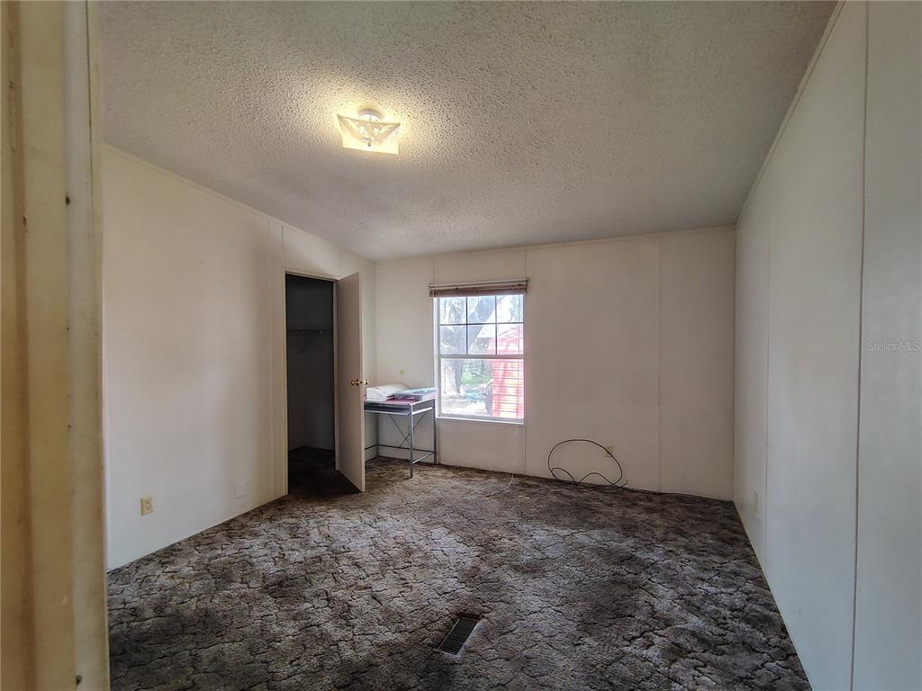 14240 State Rte 471 Webster, FL 33597 - Photo 15 of 54 a view of empty room with window