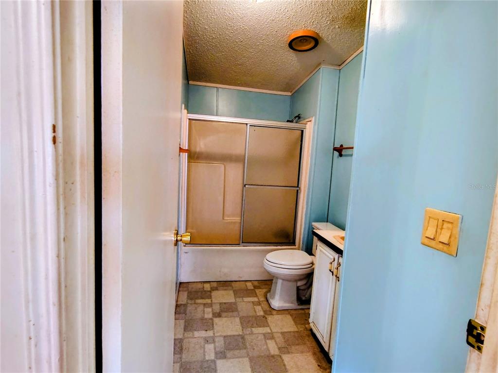 14240 State Rte 471 Webster, FL 33597 - Photo 17 of 54 a bathroom with a toilet and a shower