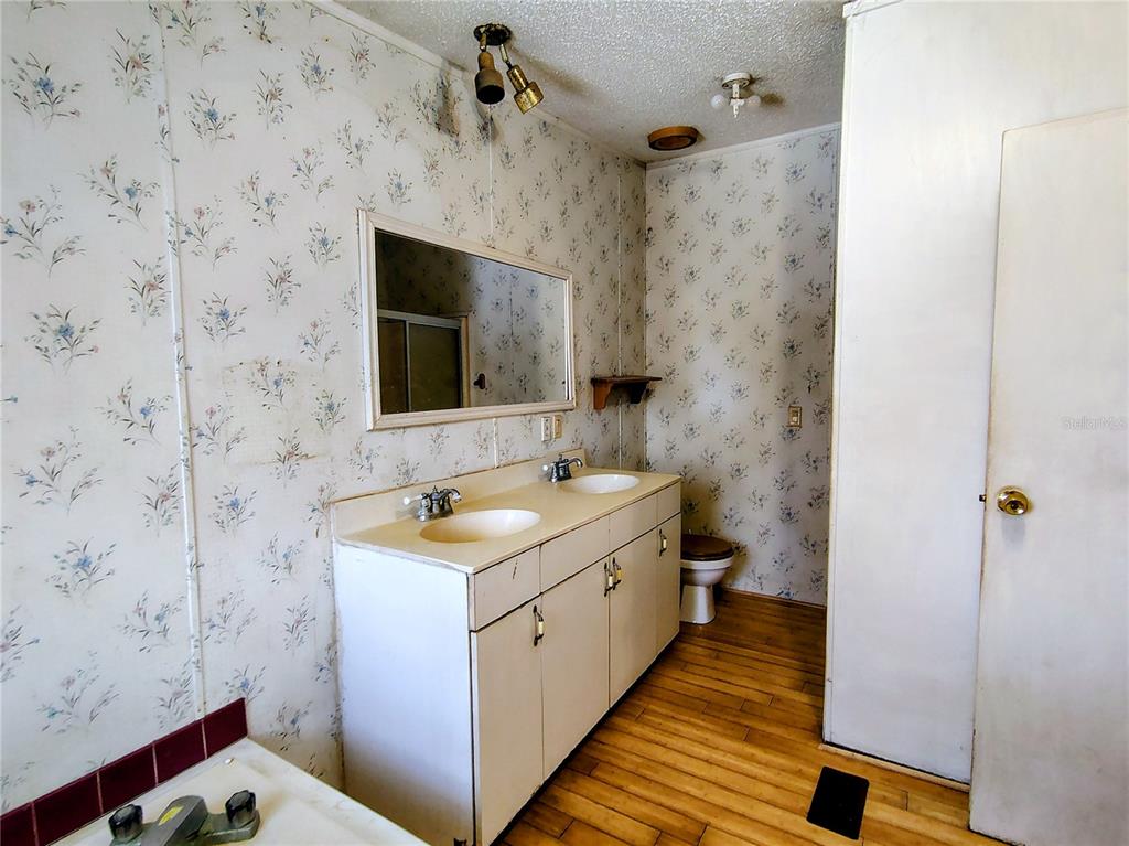 14240 State Rte 471 Webster, FL 33597 - Photo 18 of 54 a bathroom with a sink and a mirror