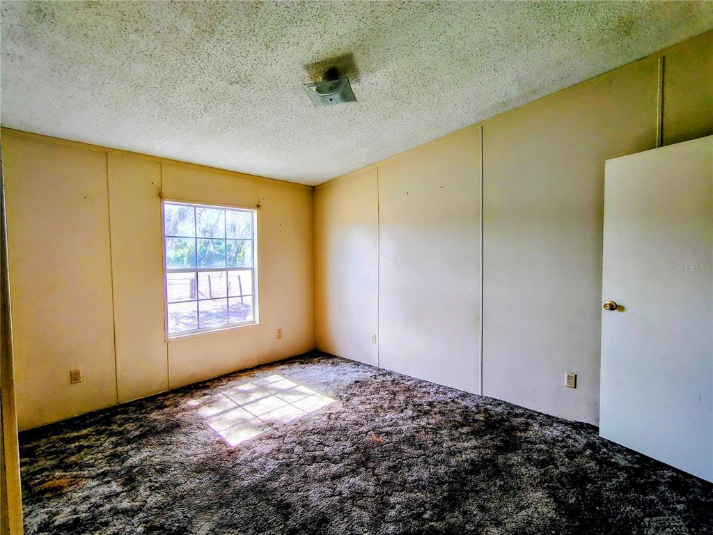 14240 State Rte 471 Webster, FL 33597 - Photo 19 of 54 a view of empty room with window