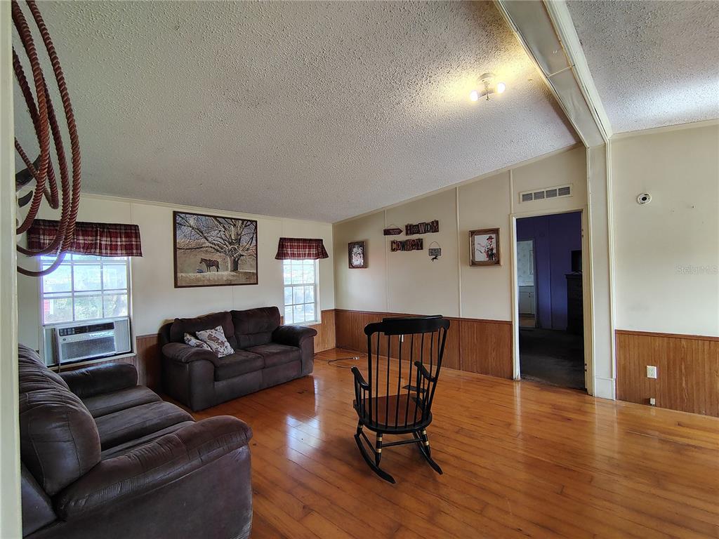 14240 State Rte 471 Webster, FL 33597 - Photo 20 of 54 a living room with furniture and a wooden floor