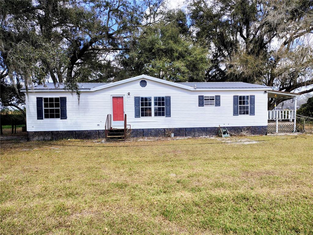 14240 State Rte 471 Webster, FL 33597 - Photo 40 of 54 a front view of house with yard and swimming pool