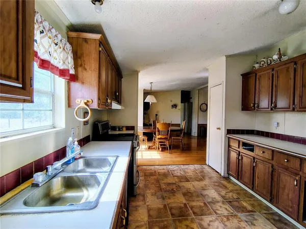 a kitchen with stainless steel appliances a refrigerator and a sink