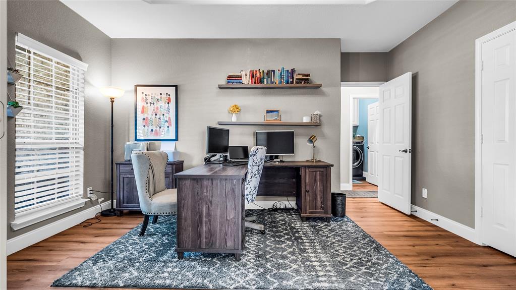 3608 Acropolis Way Plano, TX 75074 - Photo 20 of 37 a living room with furniture and a wooden floor