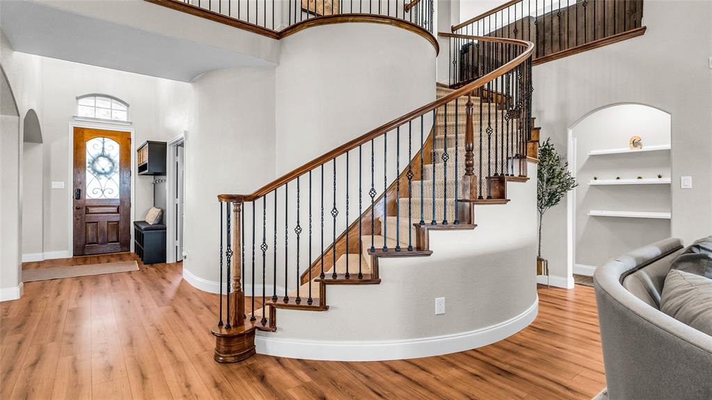 3608 Acropolis Way Plano, TX 75074 - Photo 21 of 37 a view of staircase with wooden floor and a rug
