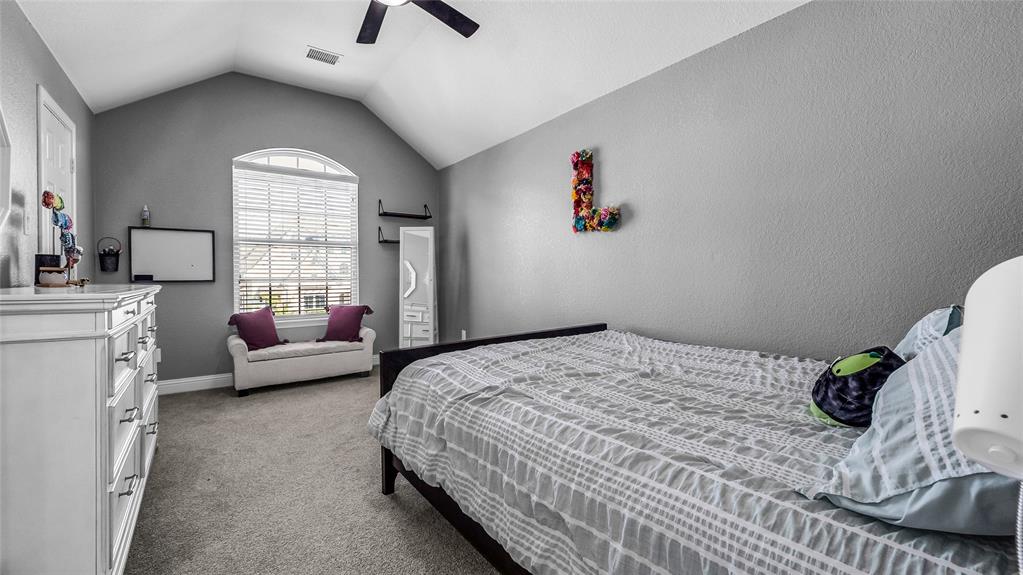 3608 Acropolis Way Plano, TX 75074 - Photo 27 of 37 a bedroom with a bed and a couch