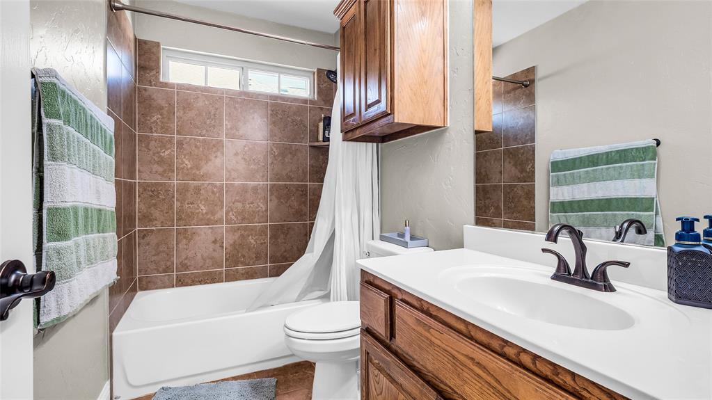 3608 Acropolis Way Plano, TX 75074 - Photo 29 of 37 a bathroom with a sink and a mirror