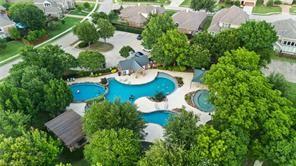 3608 Acropolis Way Plano, TX 75074 - Photo 35 of 37 an aerial view of a house with a yard and green space