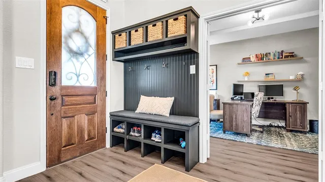 a spacious bathroom with a double vanity sink a mirror and a toilet