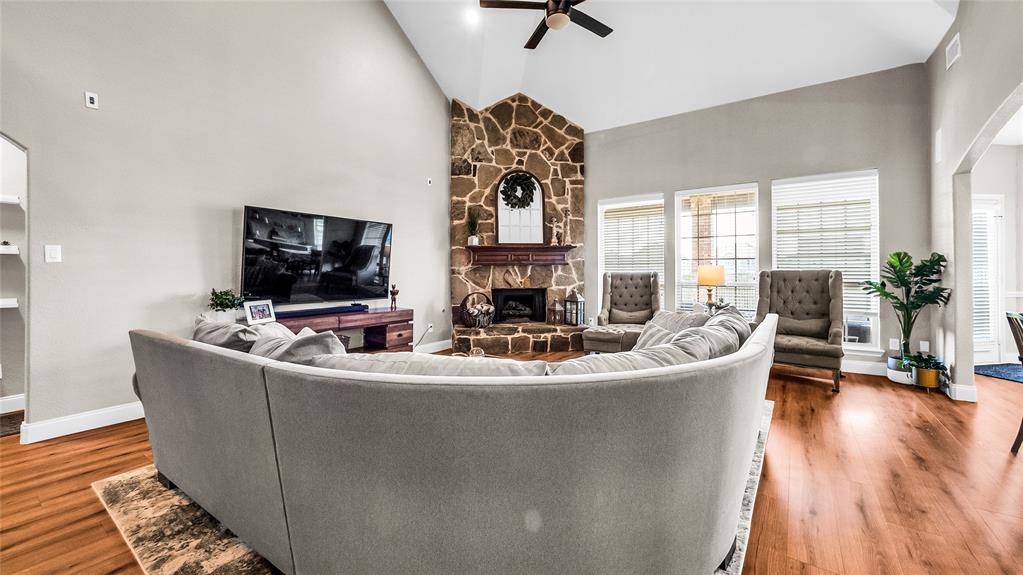 3608 Acropolis Way Plano, TX 75074 - Photo 10 of 37 a living room with fireplace furniture and a flat screen tv