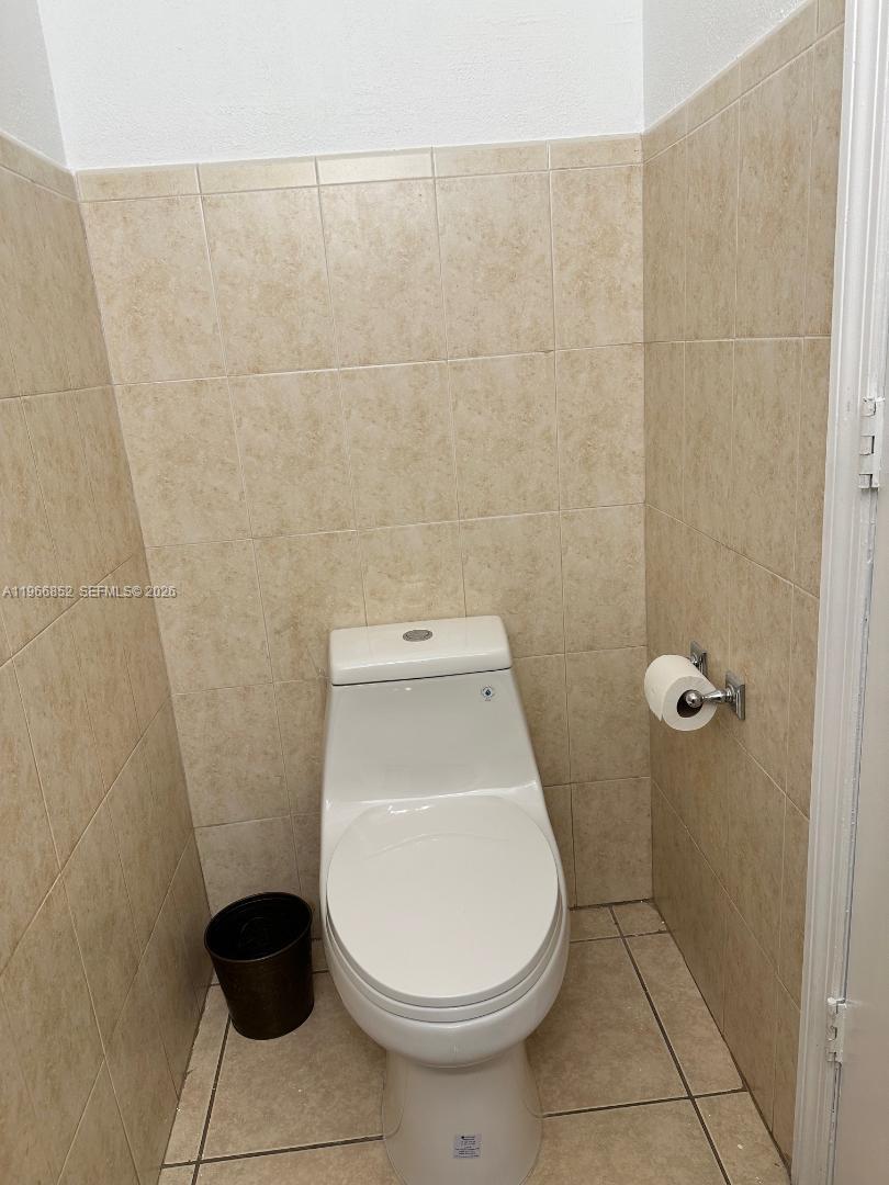 7205 West 3rd Avenue Hialeah, FL 33014 - Photo 11 of 28 a white toilet sitting next to a white sink