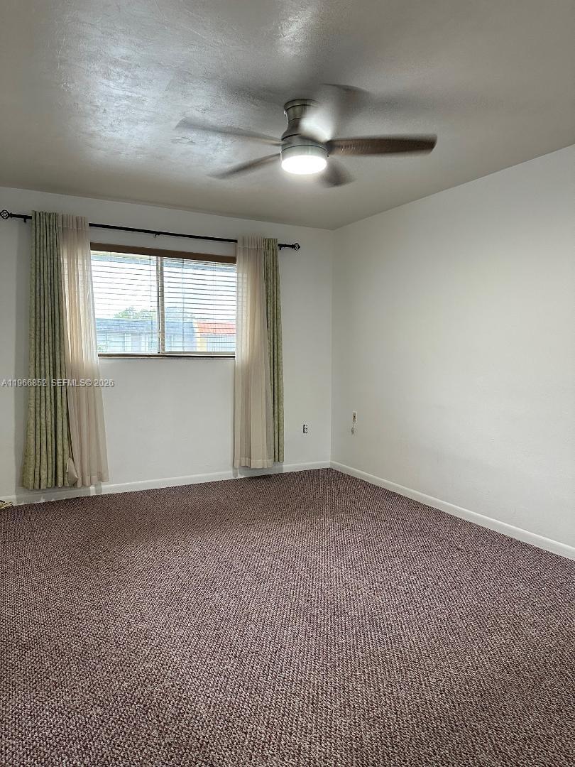 7205 West 3rd Avenue Hialeah, FL 33014 - Photo 13 of 28 an empty room with a empty space and windows