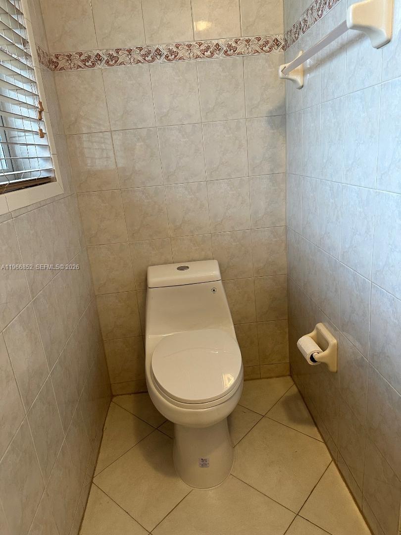 7205 West 3rd Avenue Hialeah, FL 33014 - Photo 20 of 28 a bathroom with a toilet and a shower