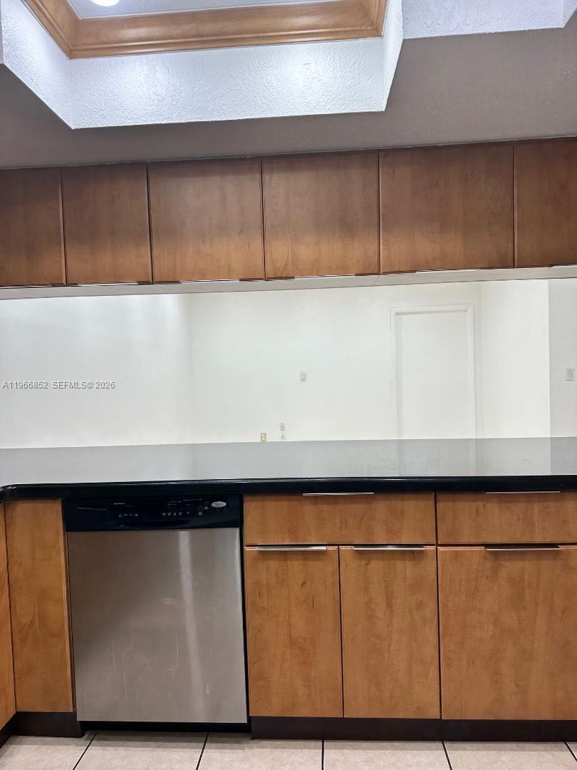 7205 West 3rd Avenue Hialeah, FL 33014 - Photo 2 of 28 a close view of wooden cabinets