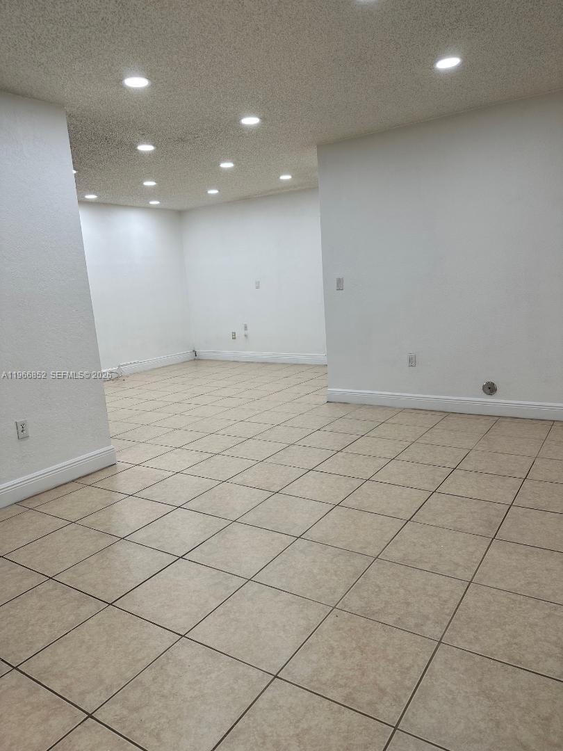7205 West 3rd Avenue Hialeah, FL 33014 - Photo 5 of 28 a view of a room with mirror