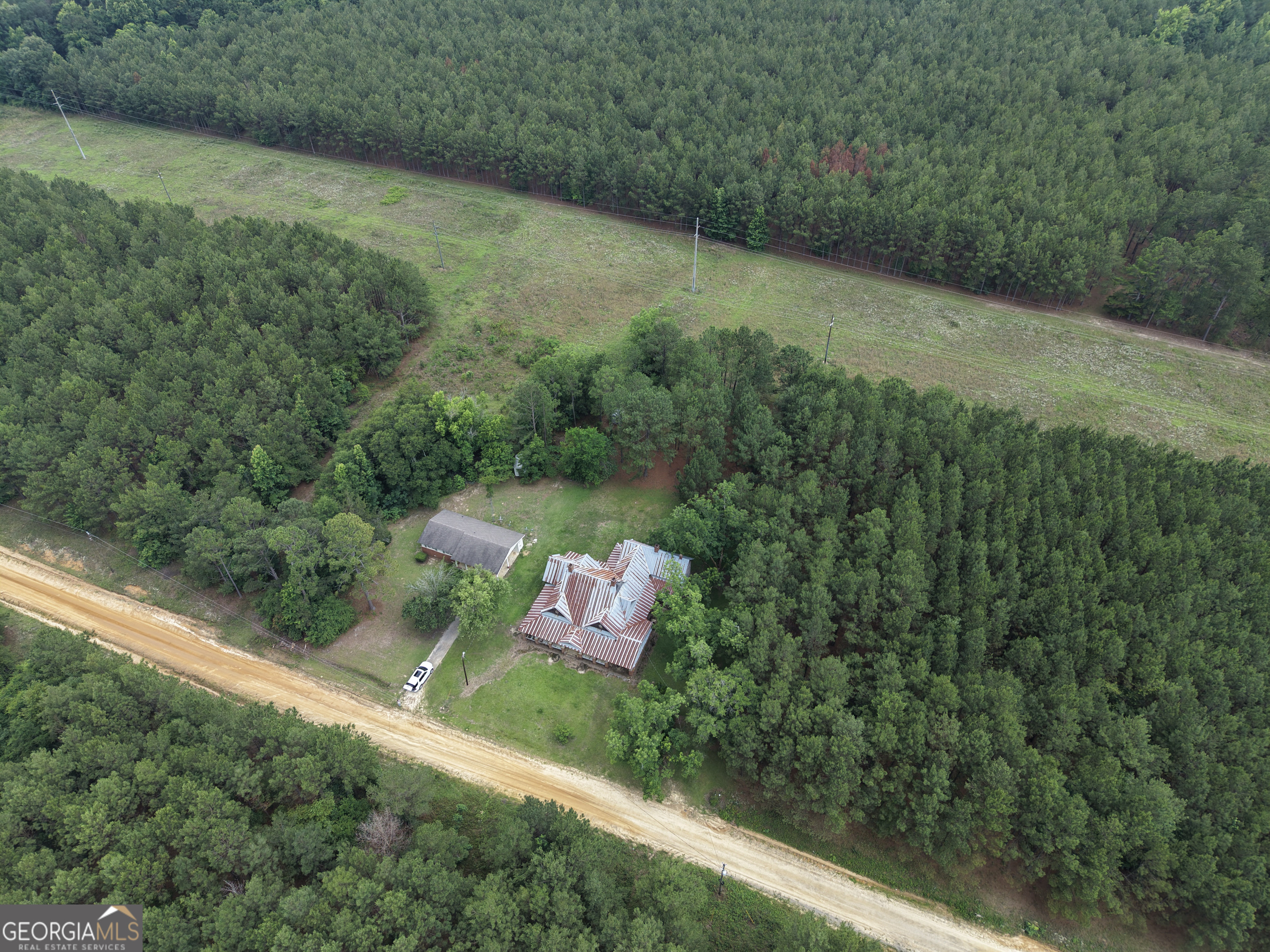 1869 Minter Blue Springs Road Rockledge, GA 30454 - Photo 5 of 45 a backyard of a house with lots of green space