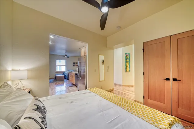 a kitchen with stainless steel appliances lots of counter top space and wooden floor