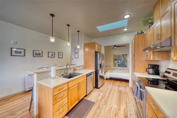 a spacious bathroom with a tub sink and mirror