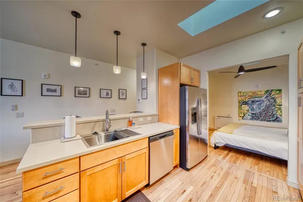 a large kitchen with a table and chairs