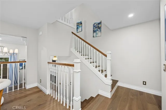 a view of entryway with stairs and wooden floor