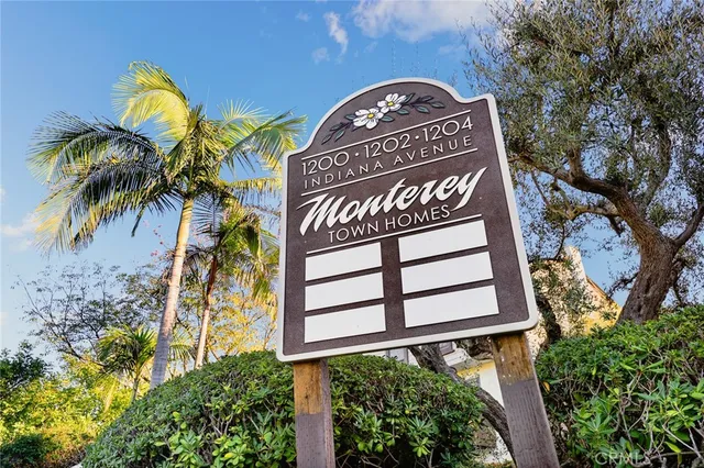 a view of a sign under a tree