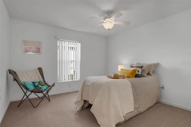 a bedroom with bed and window