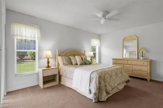 a bedroom with bed and window