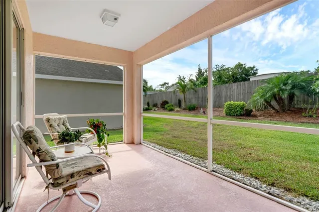 a balcony with furniture and garden