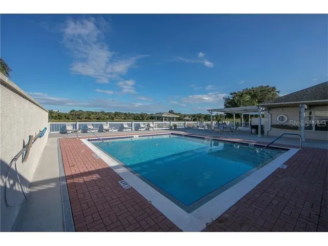 a view of a balcony with an outdoor space and seating area