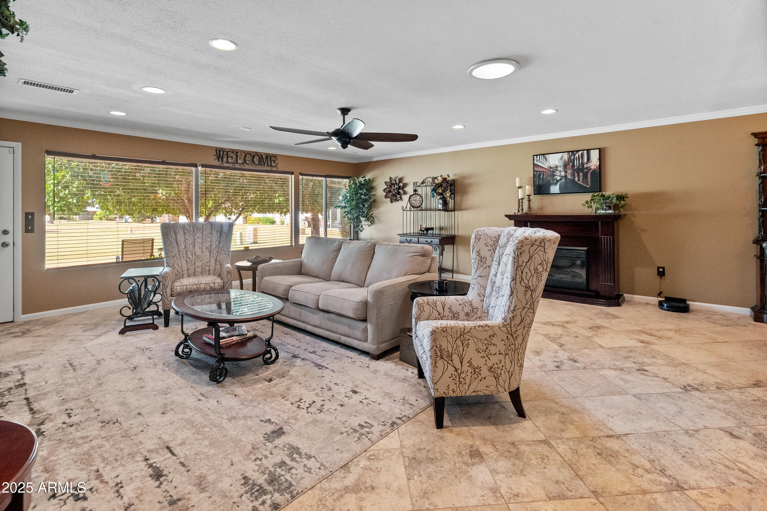 10229 West Bolivar Drive Sun City, AZ 85351 - Photo 13 of 54 a living room with furniture and large windows