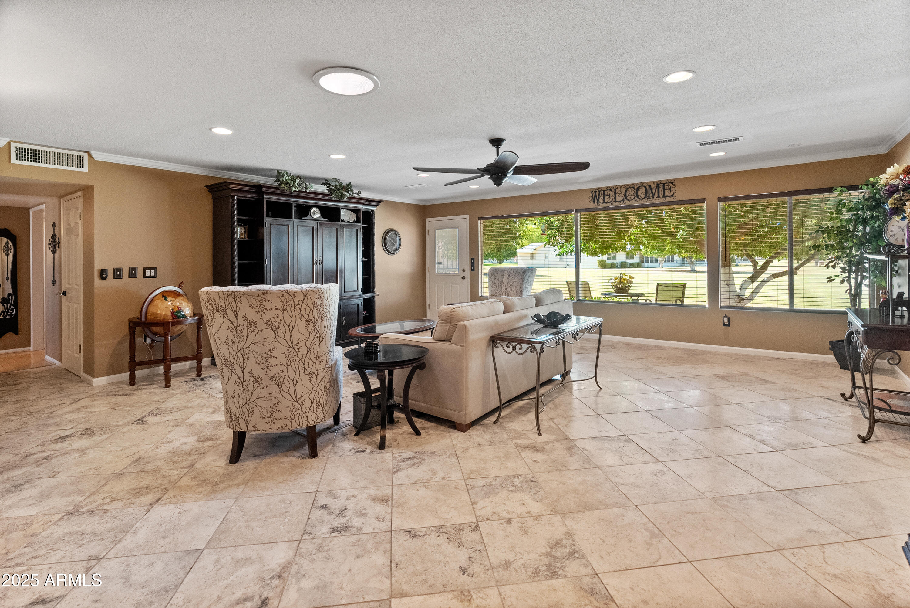 10229 West Bolivar Drive Sun City, AZ 85351 - Photo 14 of 54 a living room with furniture and a large window