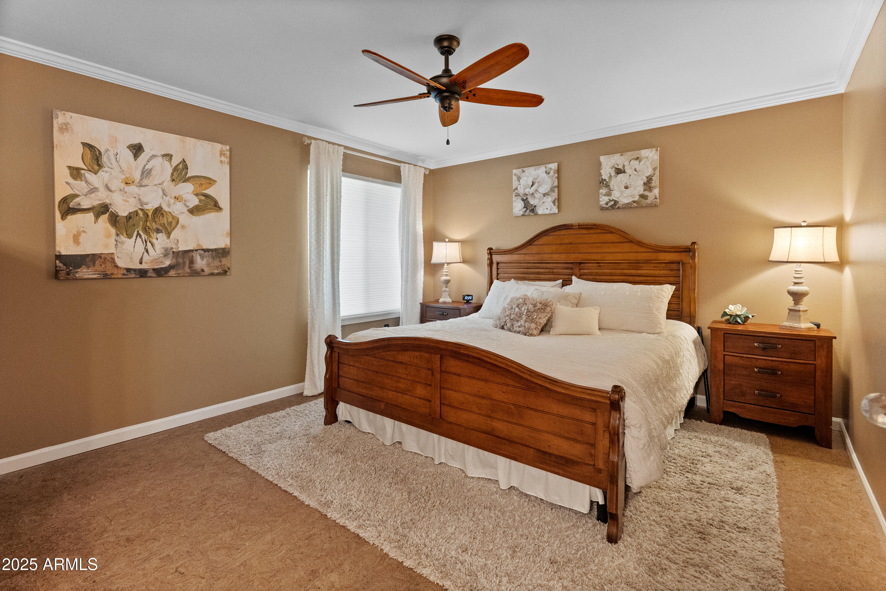 10229 West Bolivar Drive Sun City, AZ 85351 - Photo 19 of 54 a bedroom with a bed and a painting on the wall