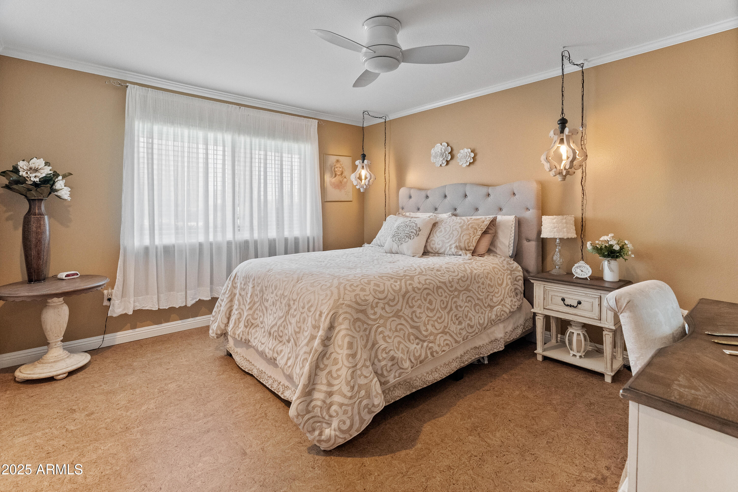 10229 West Bolivar Drive Sun City, AZ 85351 - Photo 25 of 54 a bedroom with a bed and a chair