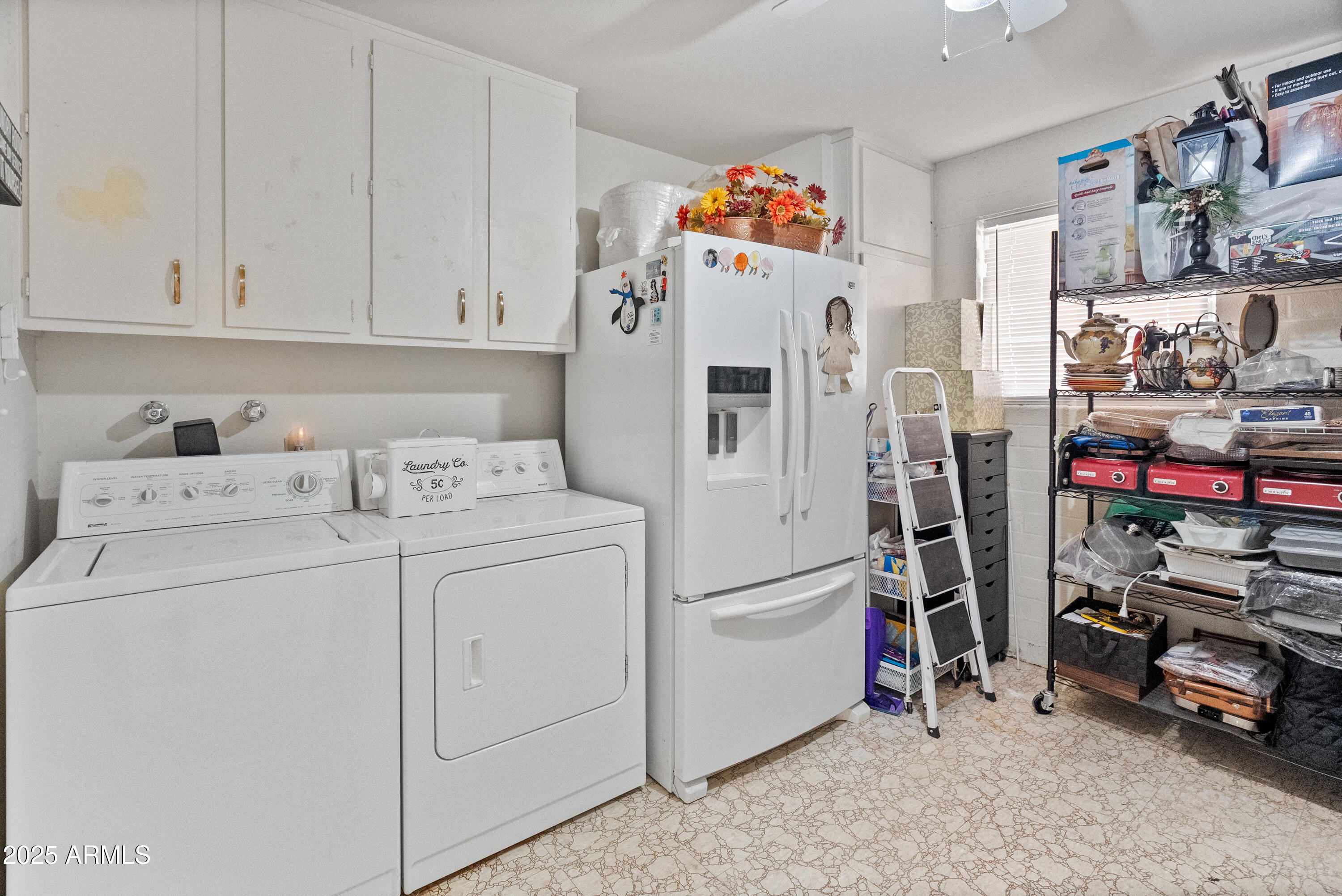 10229 West Bolivar Drive Sun City, AZ 85351 - Photo 28 of 54 a utility room with fridge dryer and washer