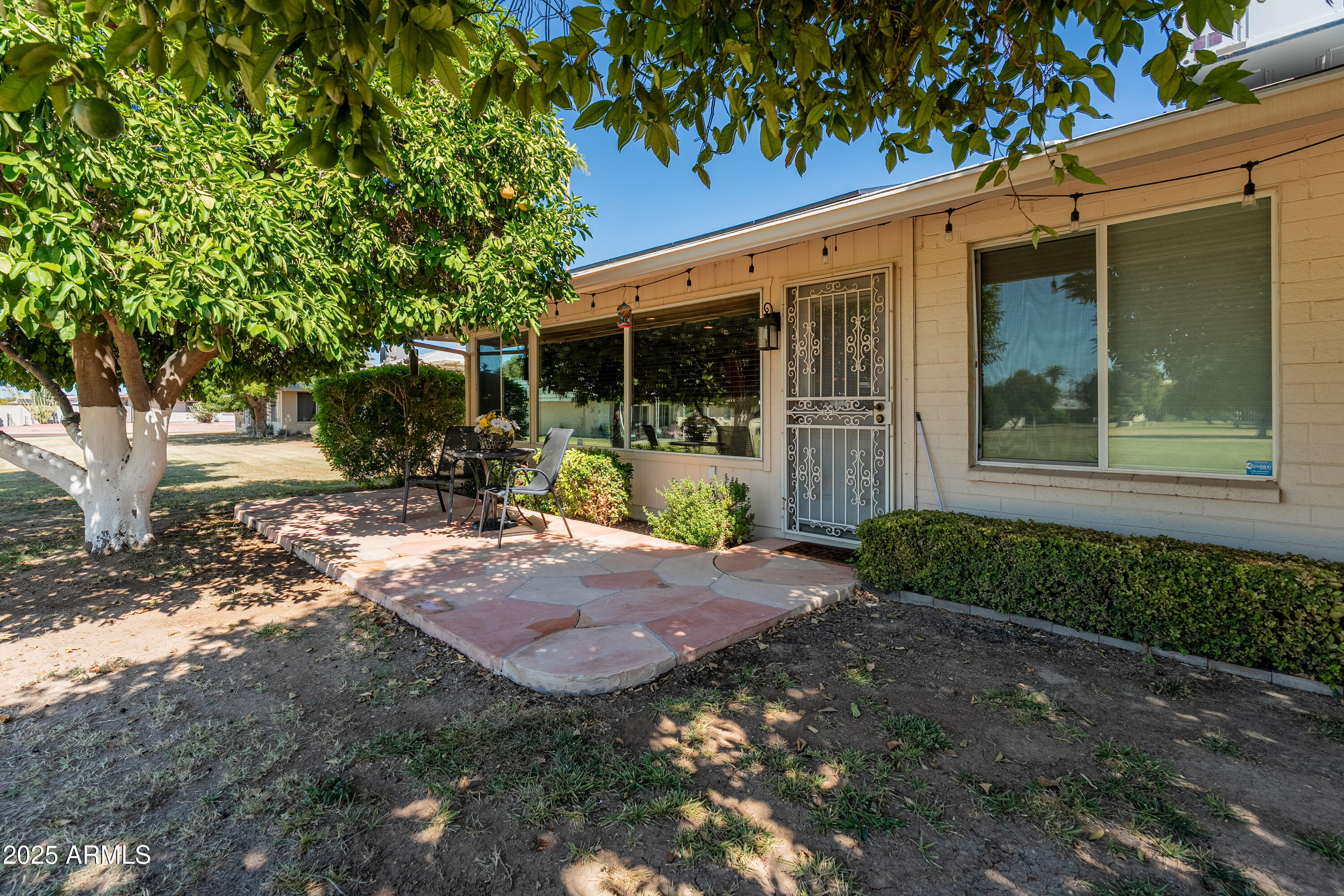 10229 West Bolivar Drive Sun City, AZ 85351 - Photo 32 of 54 a view of a house with backyard and garden