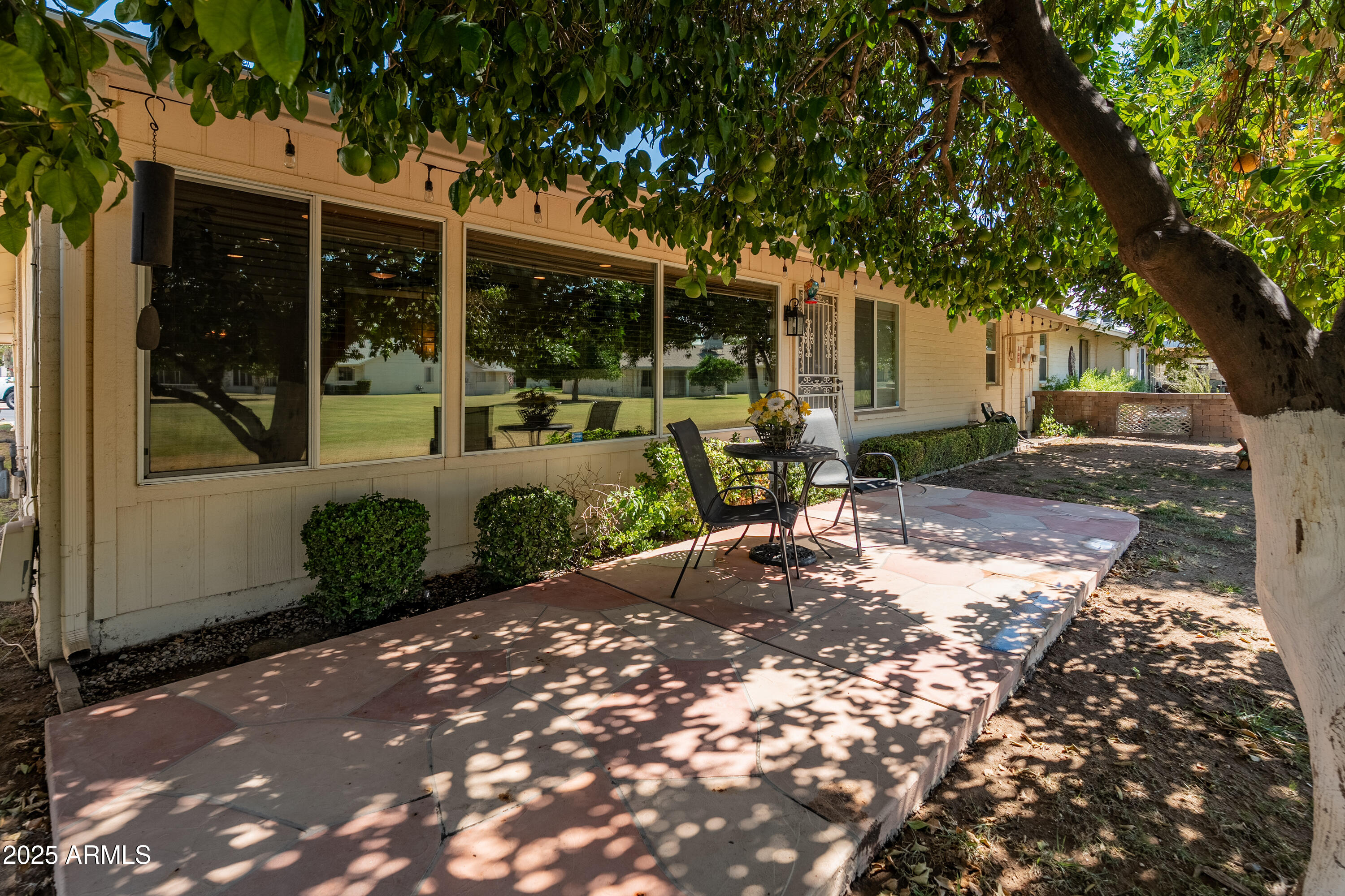10229 West Bolivar Drive Sun City, AZ 85351 - Photo 33 of 54 a view of a house with backyard porch and sitting area