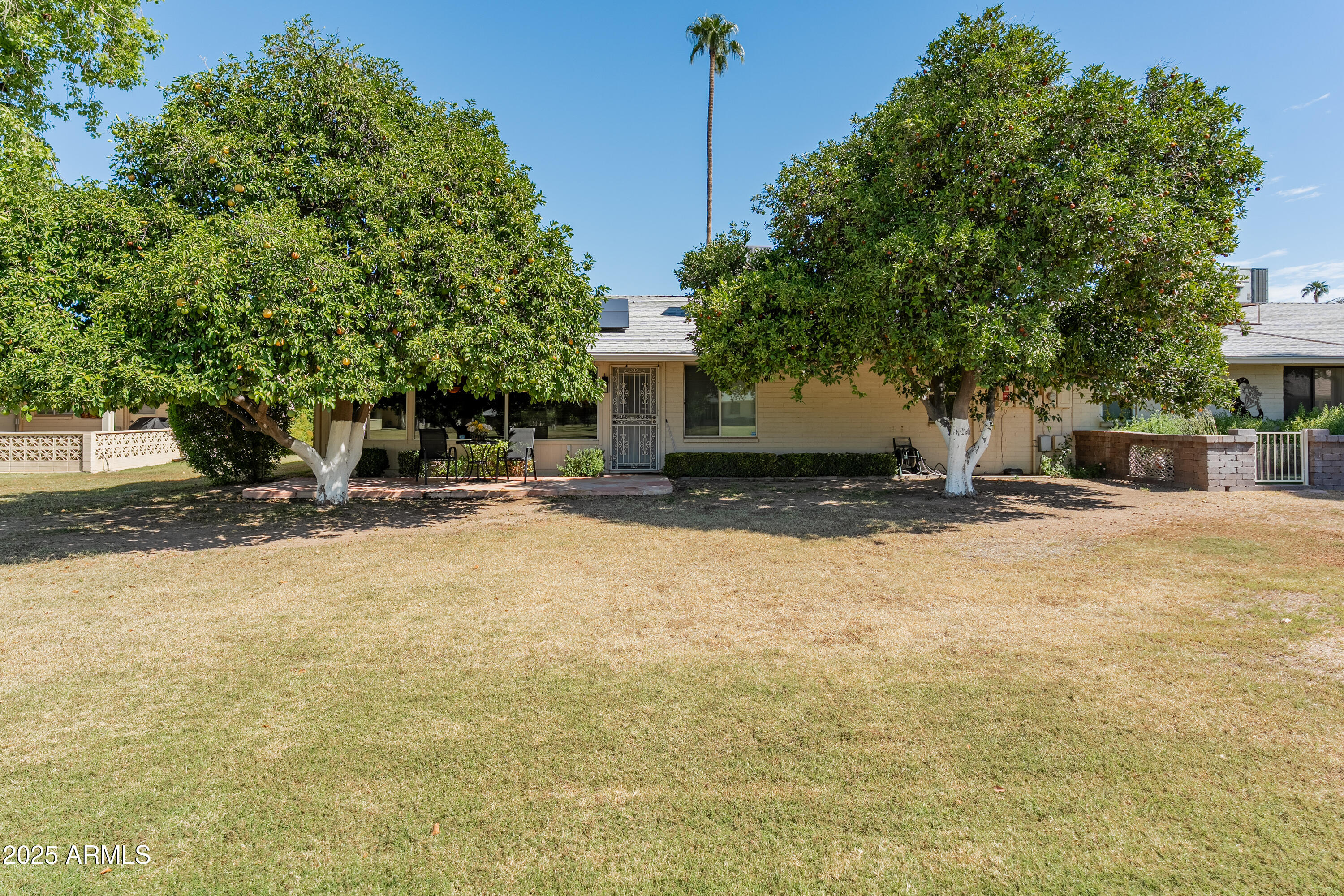 10229 West Bolivar Drive Sun City, AZ 85351 - Photo 37 of 54 a view of a house with a yard