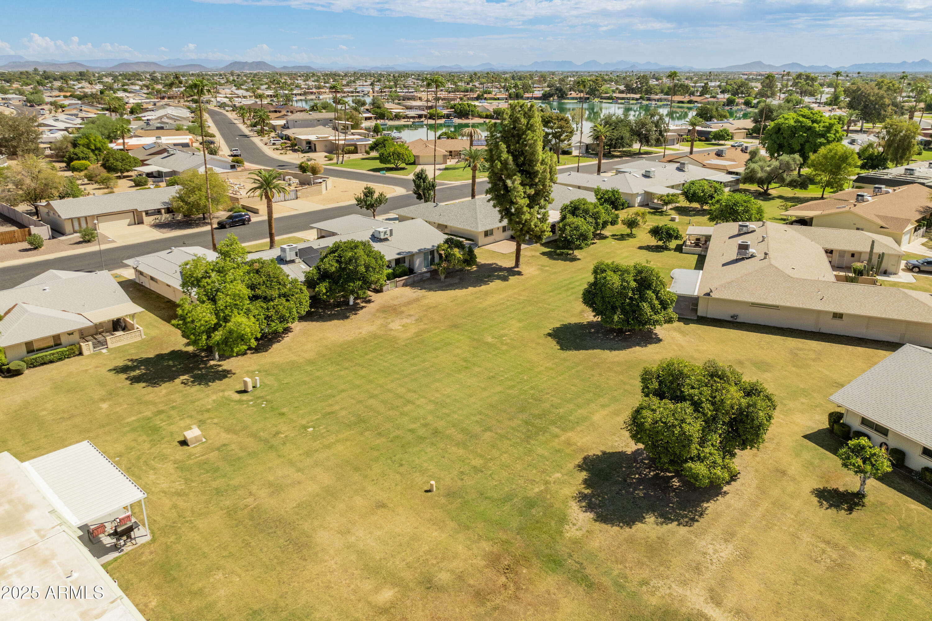 10229 West Bolivar Drive Sun City, AZ 85351 - Photo 39 of 54 an aerial view of residential houses with outdoor space