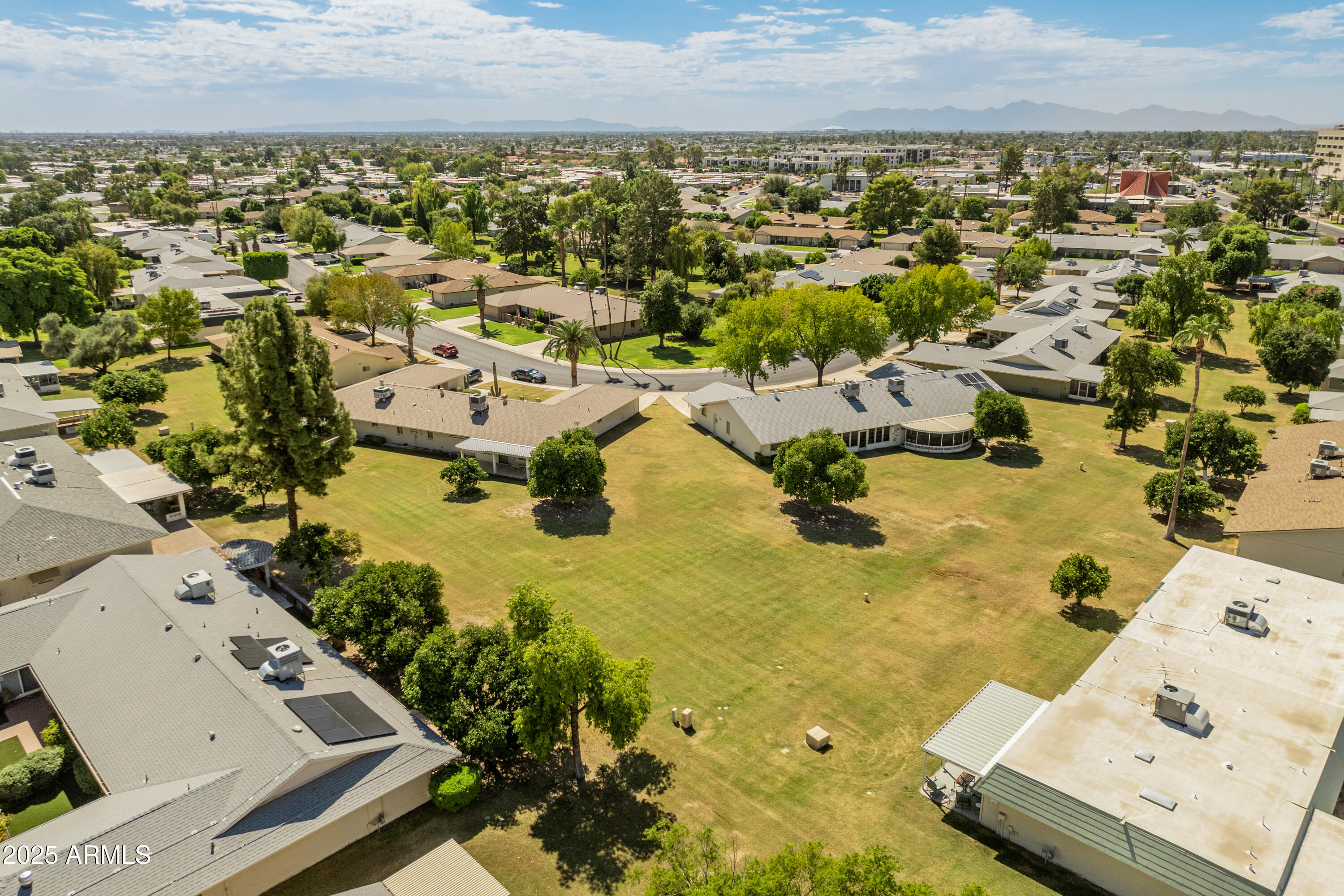 10229 West Bolivar Drive Sun City, AZ 85351 - Photo 42 of 54 an aerial view of residential houses with outdoor space
