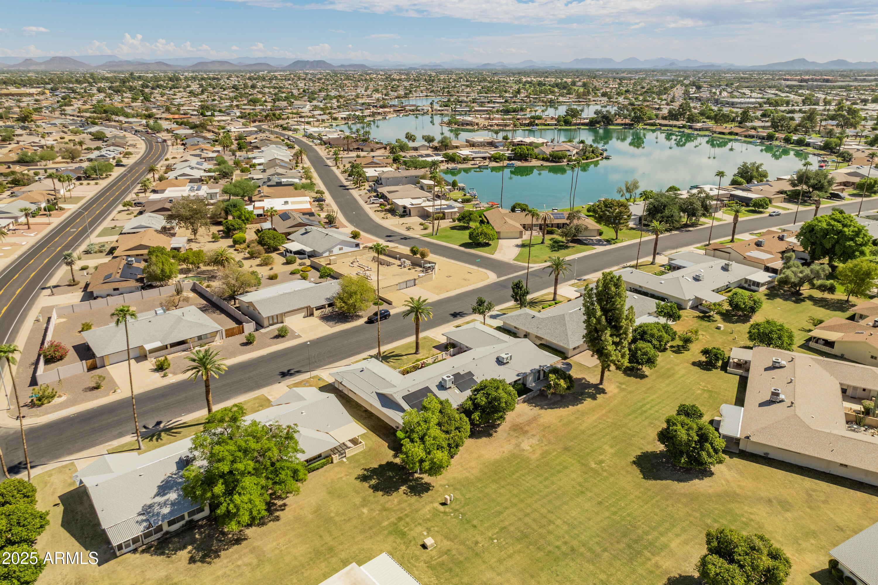 10229 West Bolivar Drive Sun City, AZ 85351 - Photo 43 of 54 an aerial view of residential building and lake