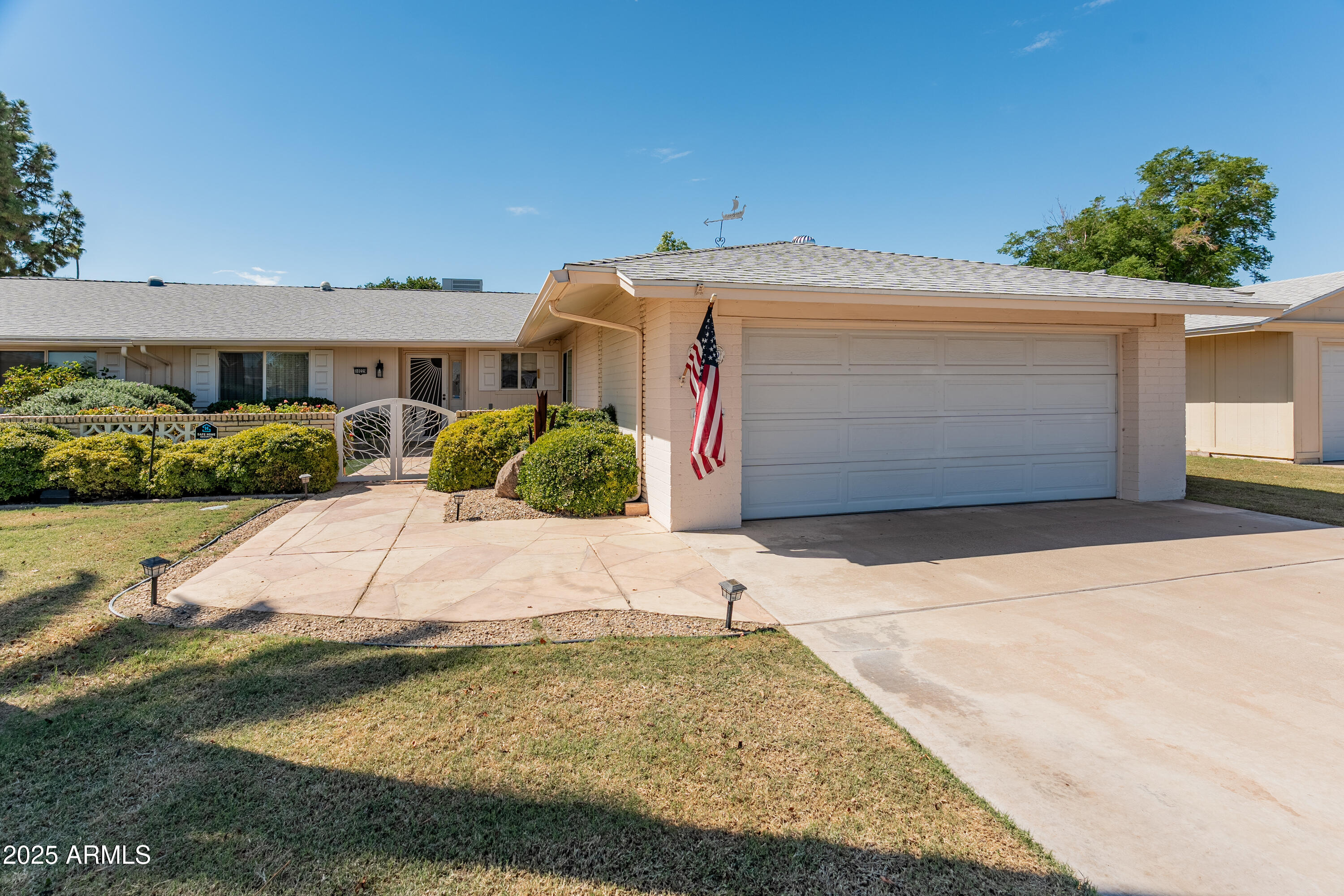 10229 West Bolivar Drive Sun City, AZ 85351 - Photo 54 of 54 a view of a house with a yard