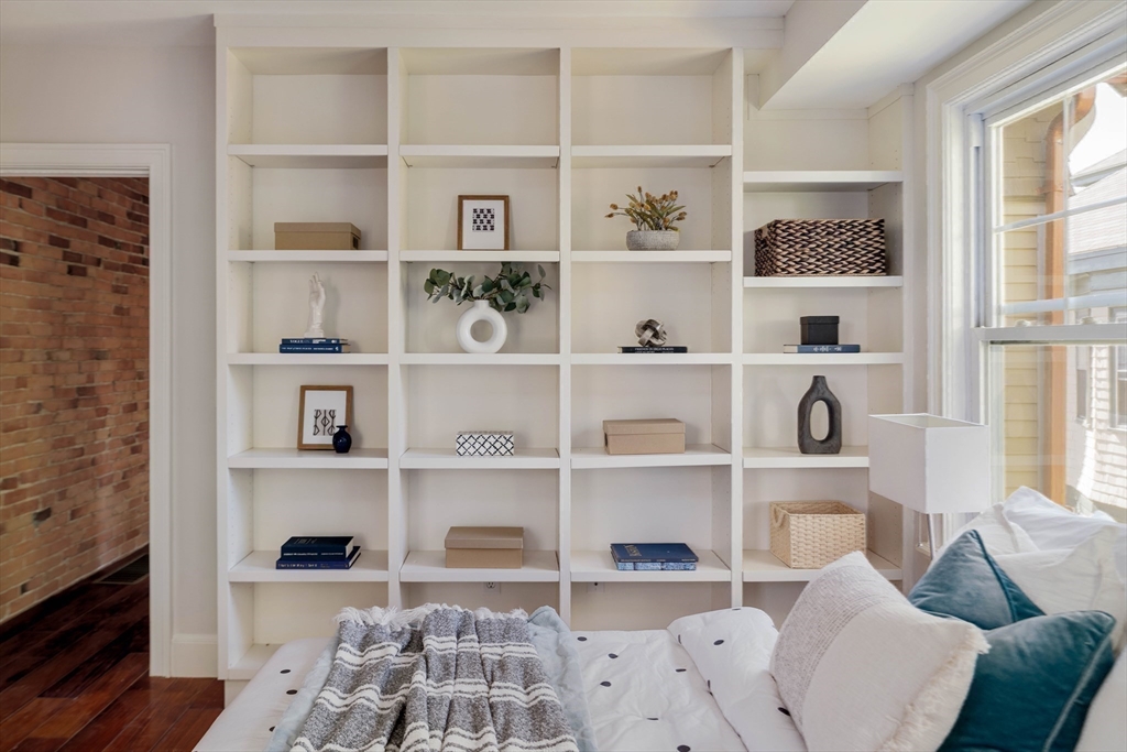 32 Hall Avenue, Unit 32 Somerville, MA 02144 - Photo 15 of 30 a living room with a book shelf