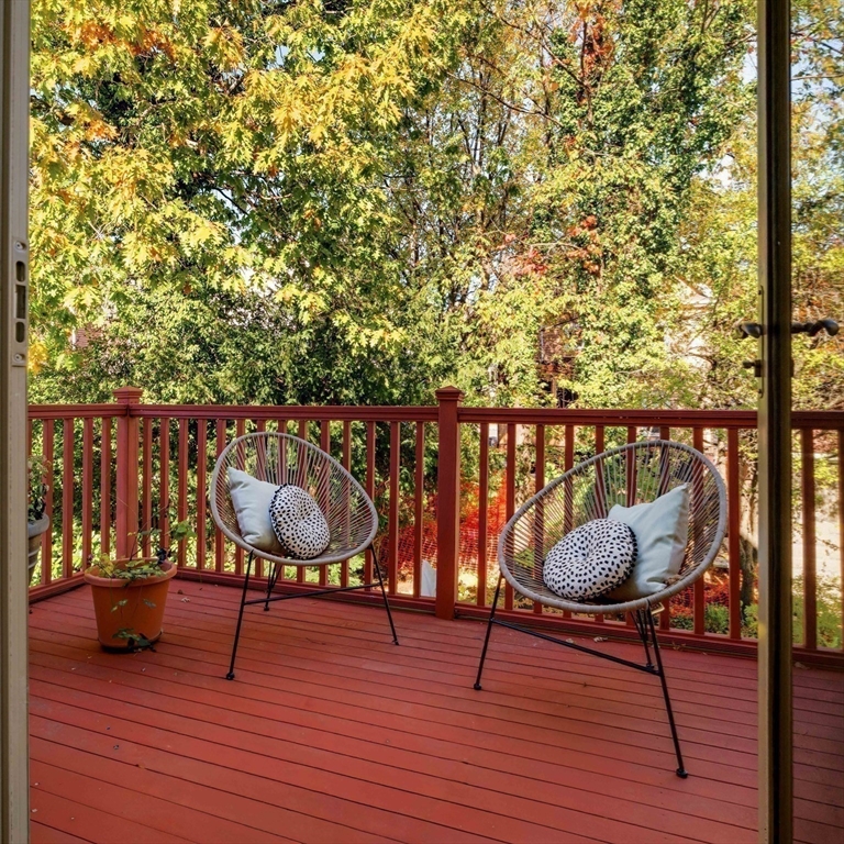 32 Hall Avenue, Unit 32 Somerville, MA 02144 - Photo 17 of 30 a view of a chairs and deck with wooden floor